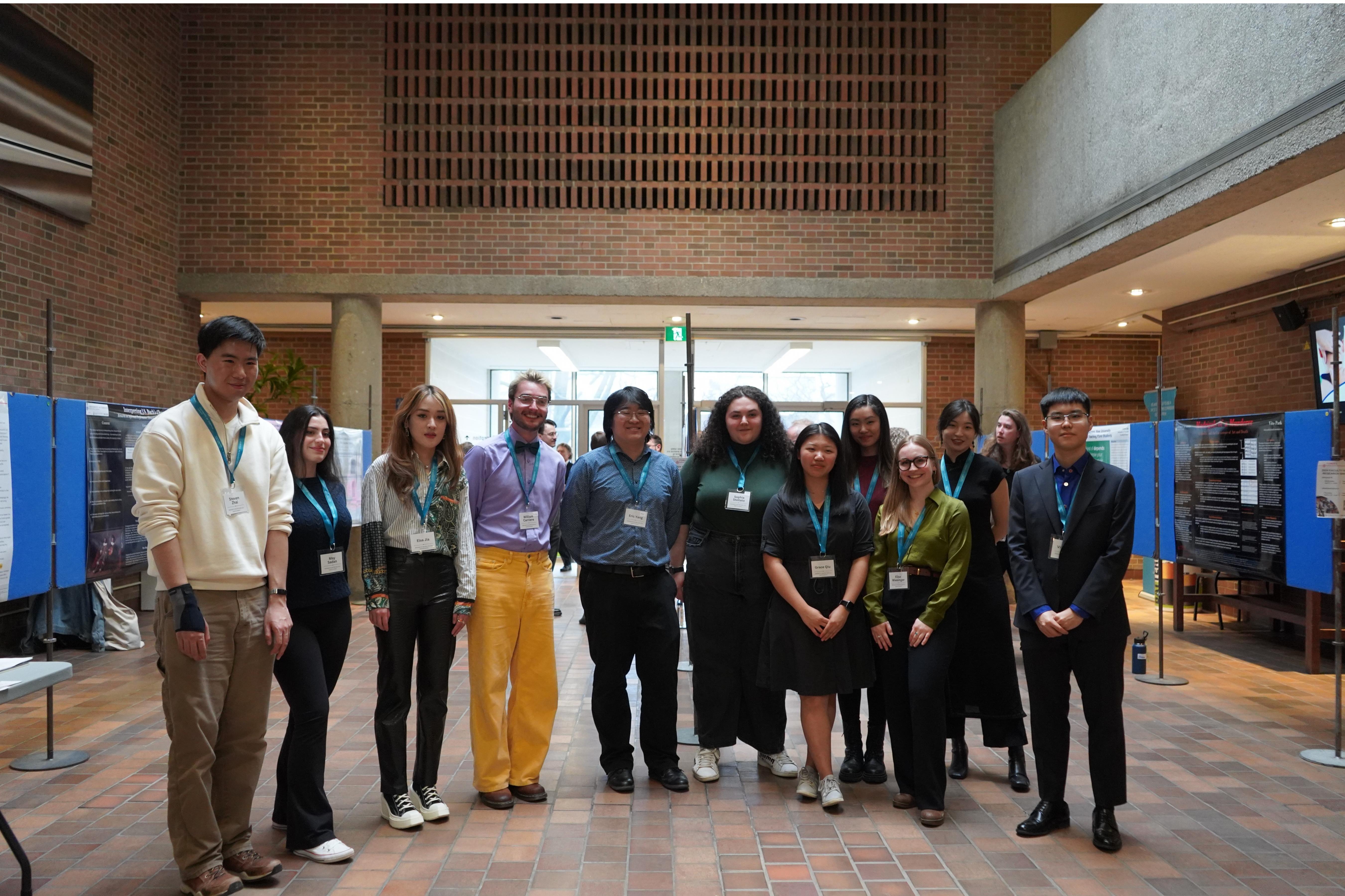 group photograph of undergraduate showcase participants smiling after event has finished.