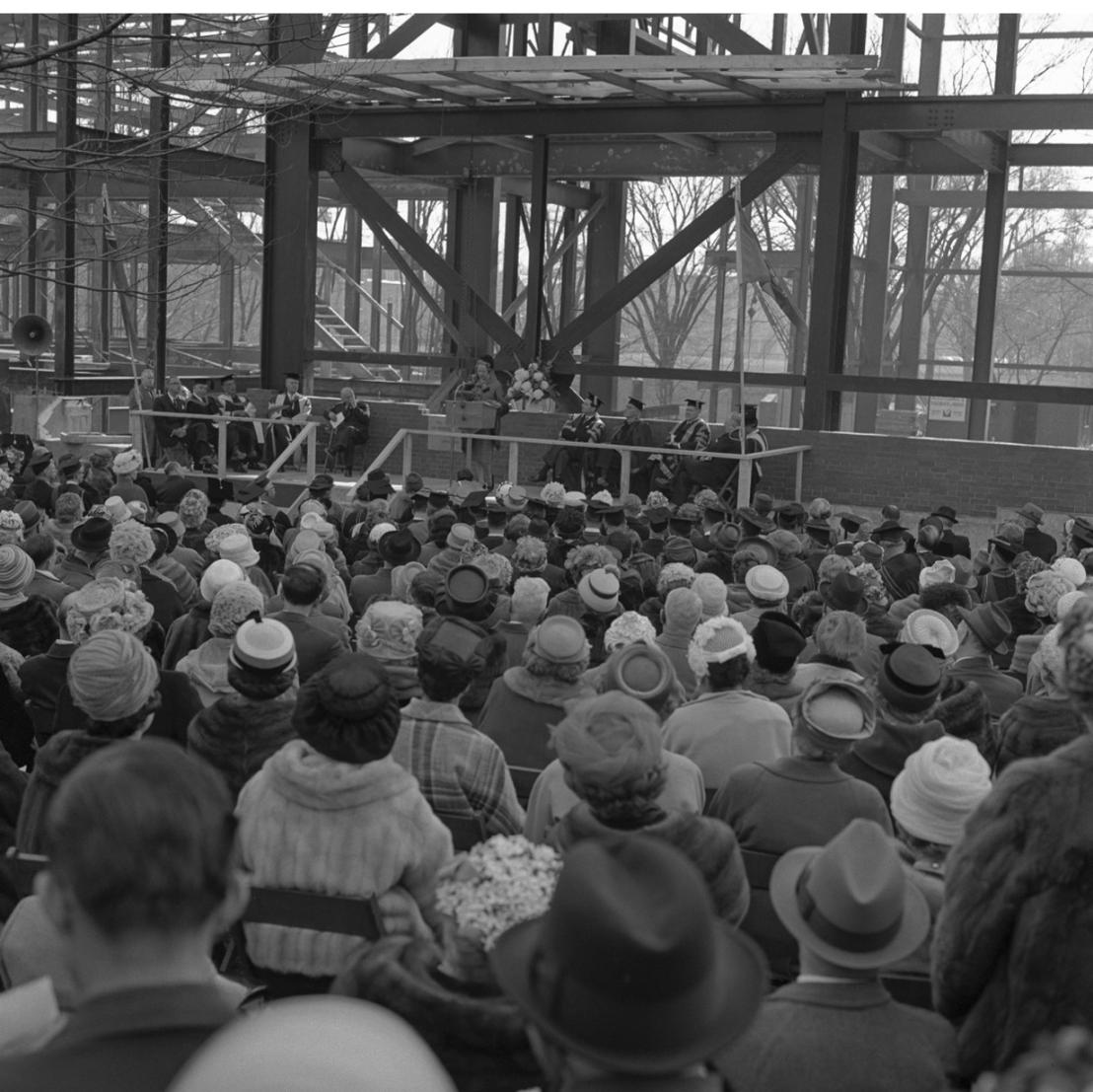 The Cornerstone Ceremony showing a gathered crowd and the framework of the building