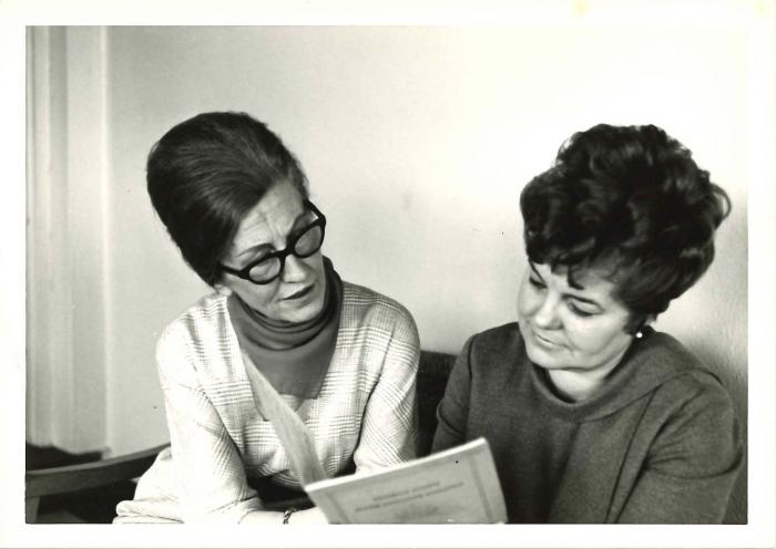 Elizabeth Benson Guy and Greta Kraus studying a score